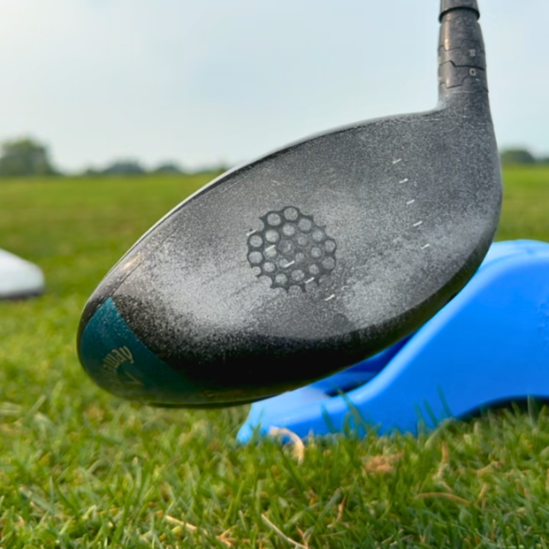Driver clubface showing a ball strike mark from the InkPact Printer coating.