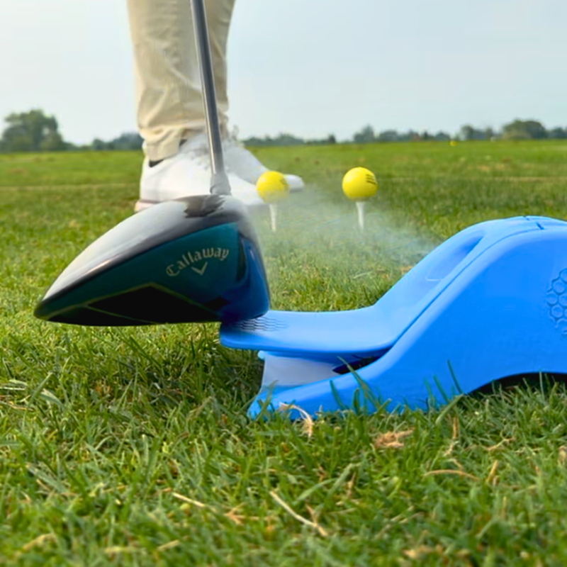 Driver pressed onto the InkPact Printer Core as it applies a coat to the clubface on the range.