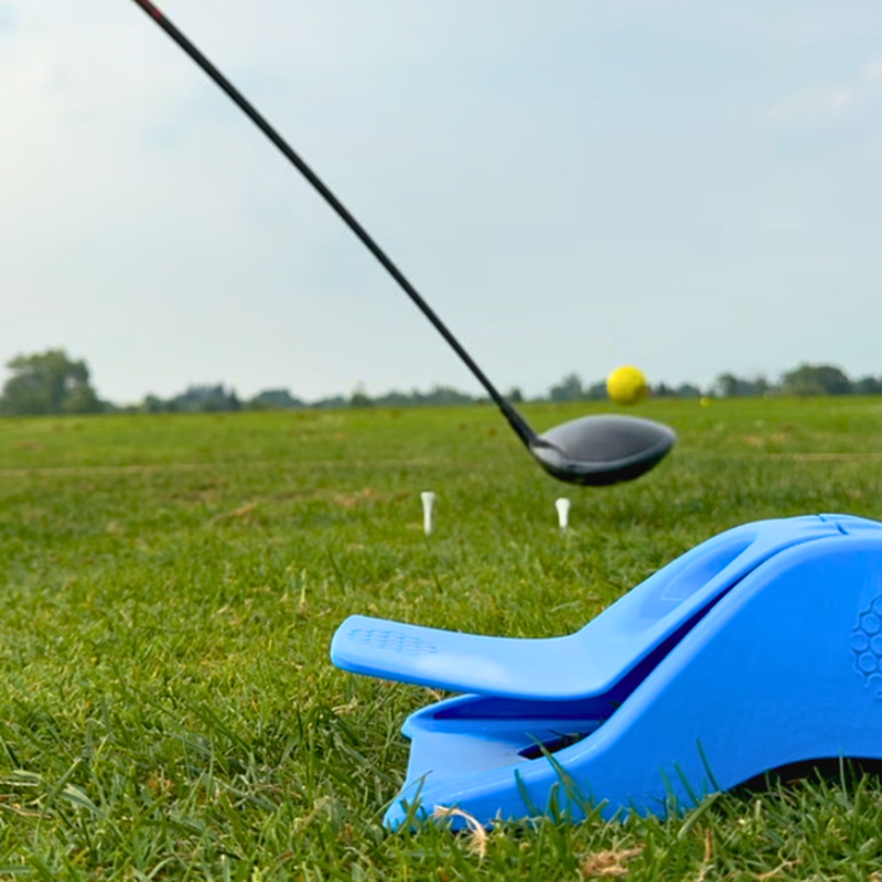 InkPact Printer Core on the range beside a golfer addressing a teed ball.