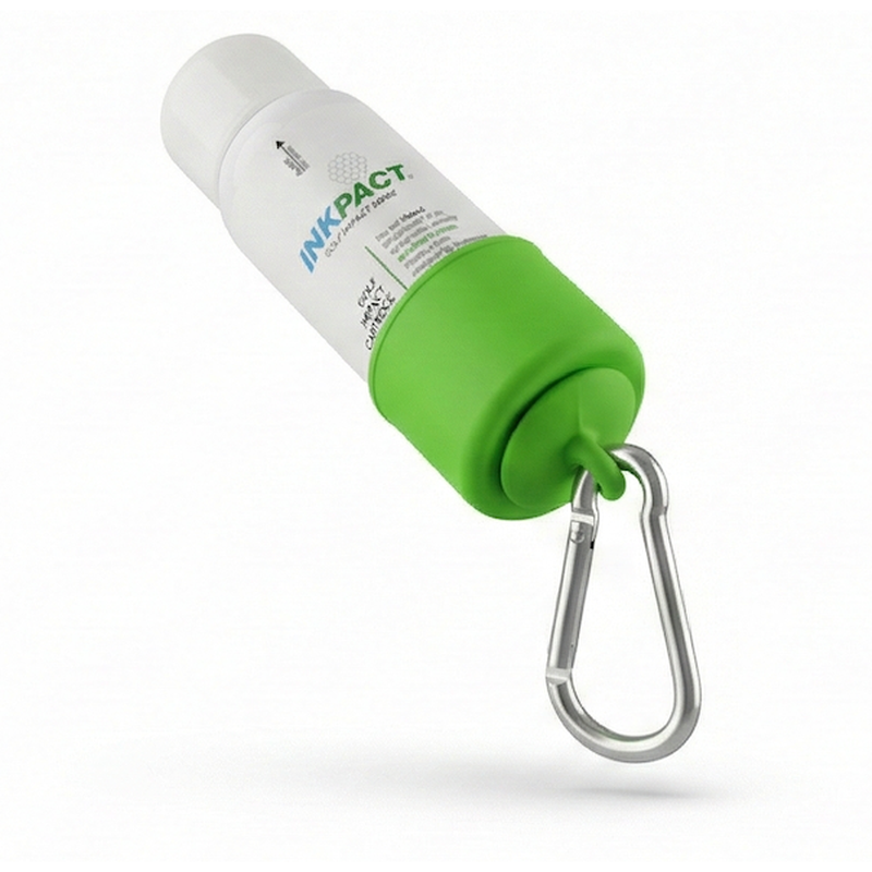 InkPact Micron spray seated in the magnetic quick connector with the carabiner clip attached.