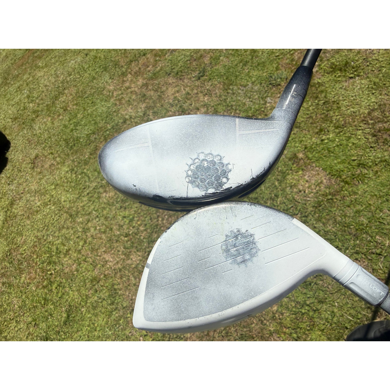 Two clubfaces coated with InkPact Micron showing ball strike marks.