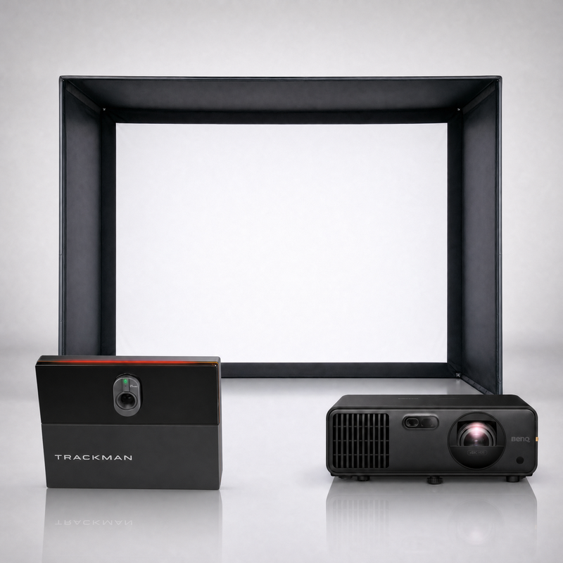 Trackman iO Commercial launch monitor package hero image showing the SIG DIY Golf Simulator Enclosure with a BenQ short-throw projector on a grey studio background.