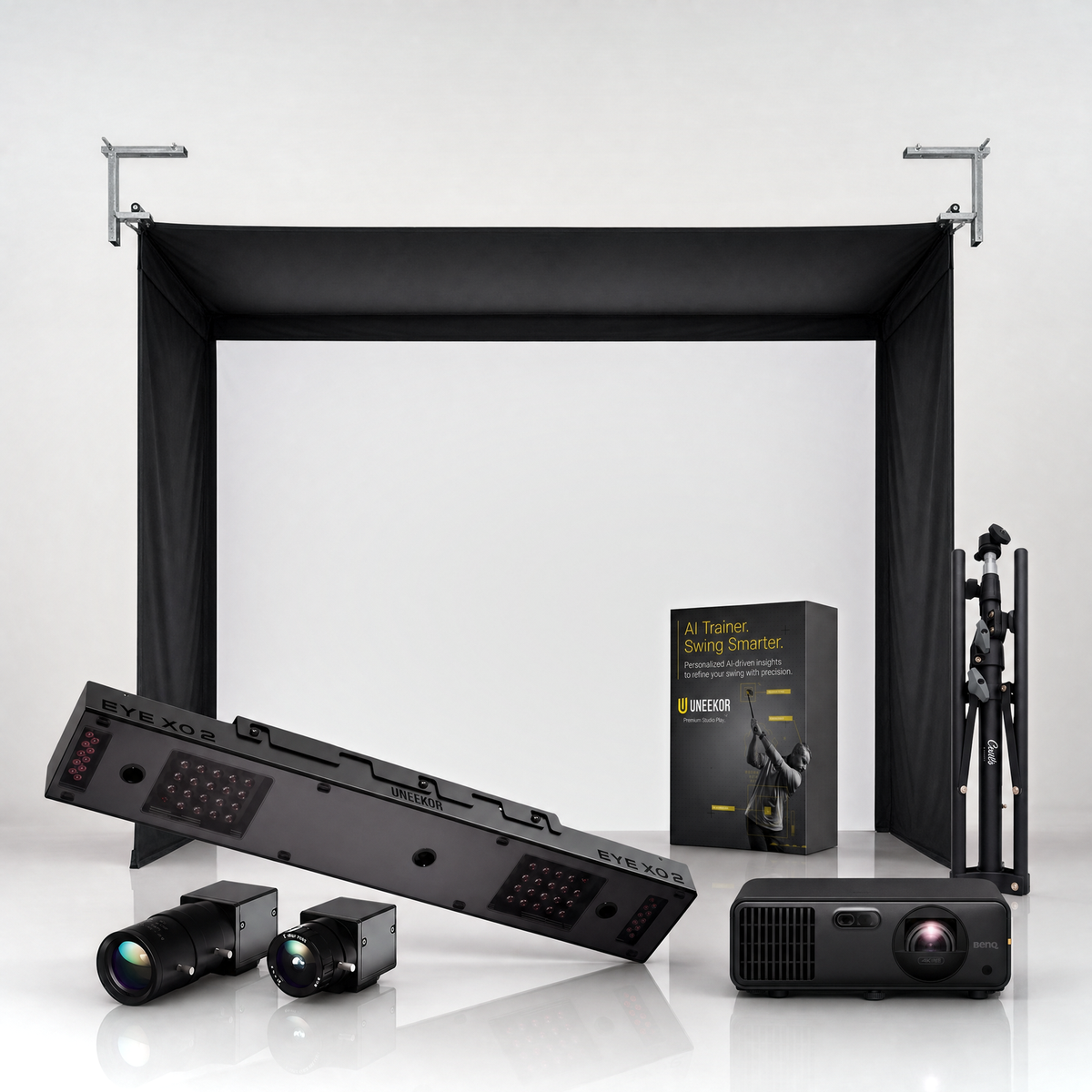 Uneekor EYE XO2 SportScreen Vanish golf simulator package hero on a grey studio background.